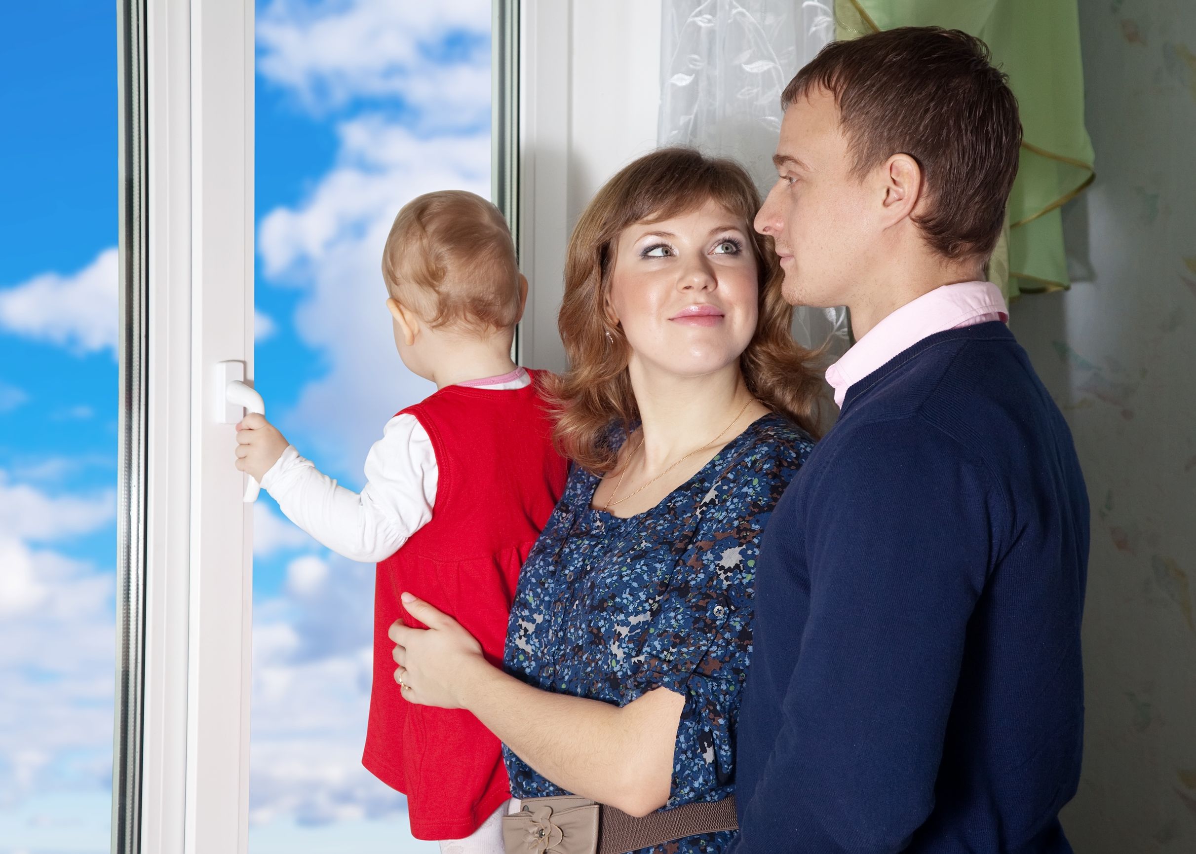 family looking out window